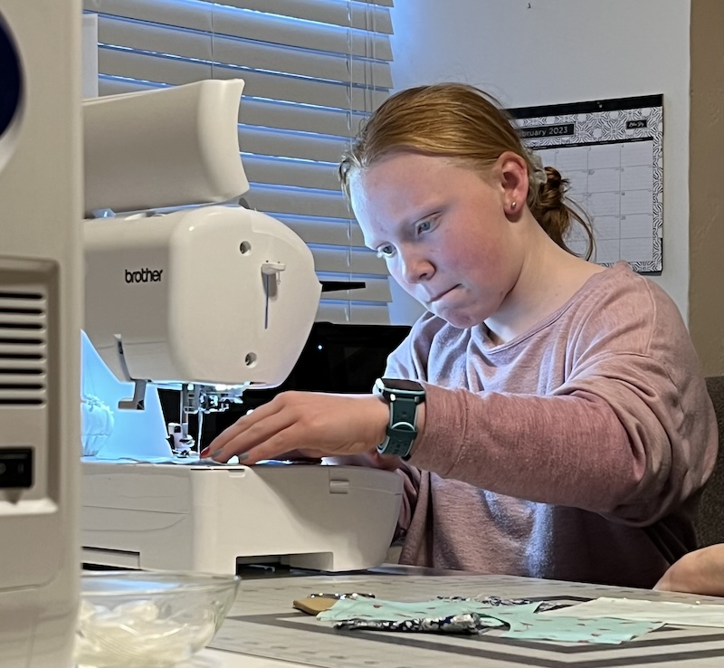 Student at sewing machine
